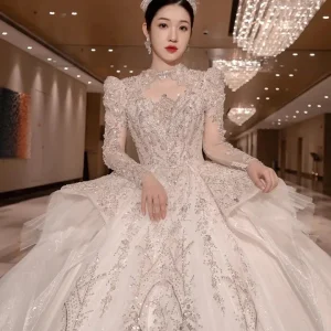 Abito da sposa di lusso con perline vintage e pizzo arabo con coda lunga e maniche lunghe applicate