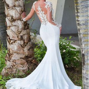 Abito da sposa a sirena con maniche lunghe e dettagli in pizzo trasparente